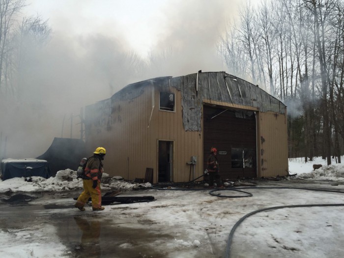 Fire destroys pole barn.