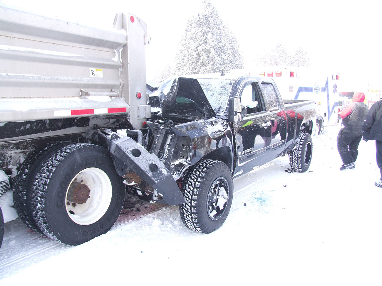 Man injured after rearending plow truck.