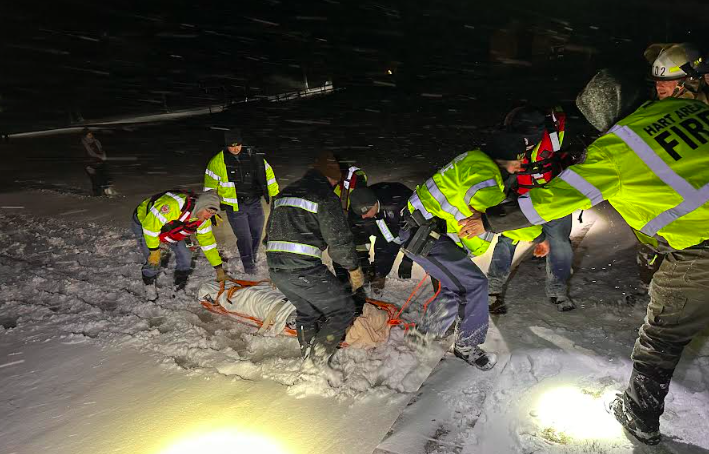 First responders rescue injured snowmobiler in blizzard conditions ...